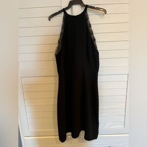 Elegant black dress with lace detailing. Brand new never worn